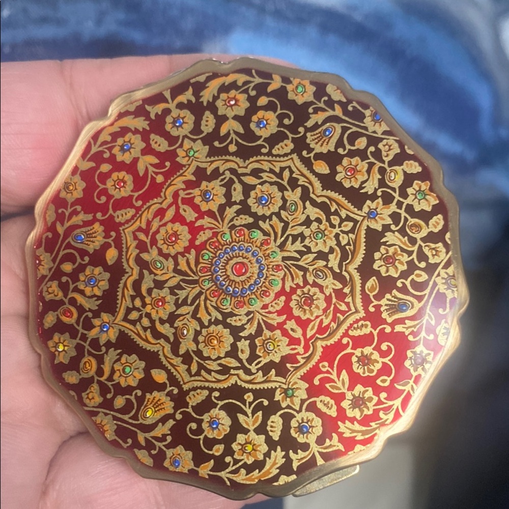 Red and Gold Ornate Brooch with Floral Motifs